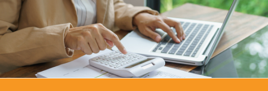 hands using a notebook and calculator