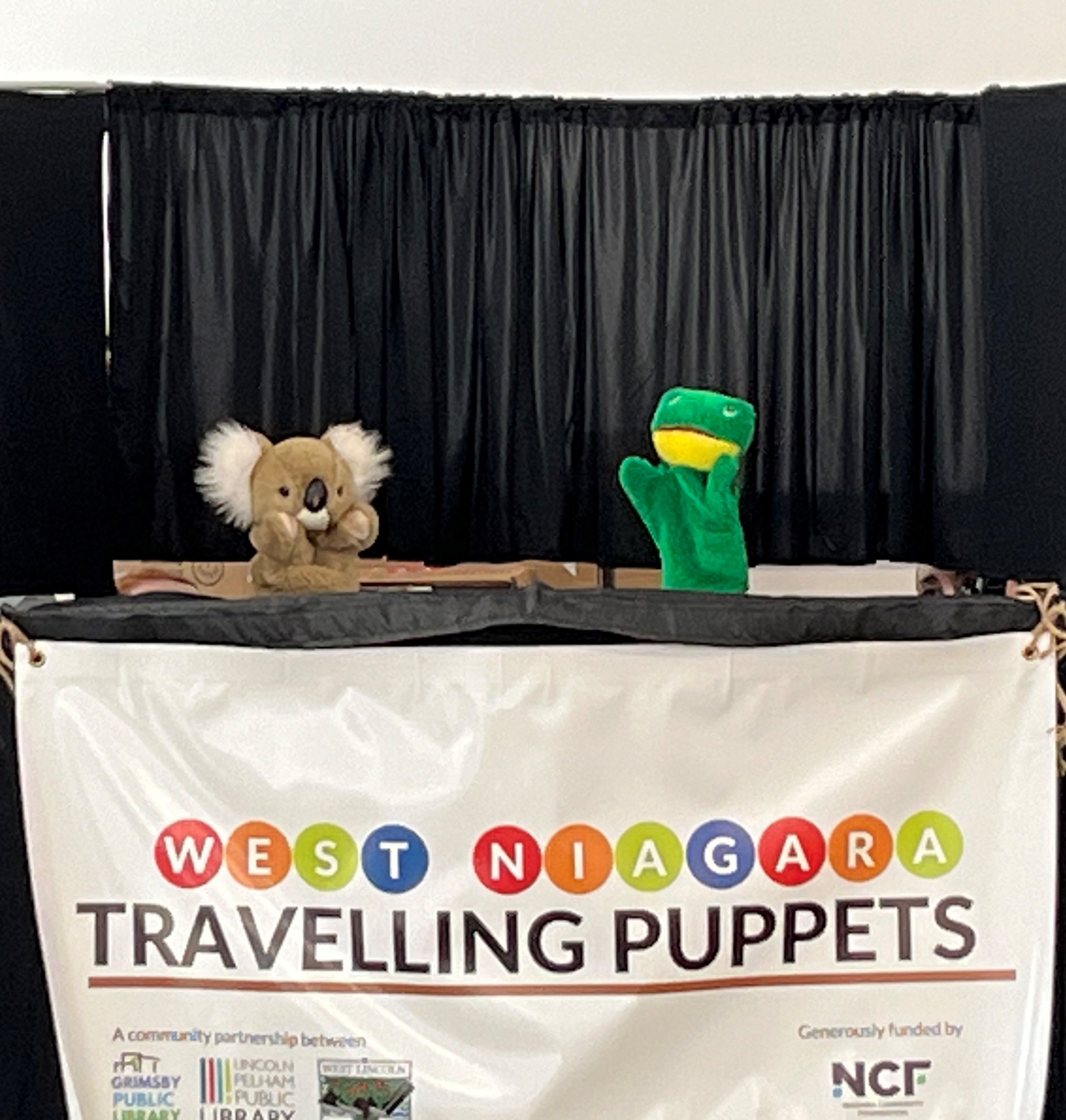 a koala and a frog puppet on the puppet stage